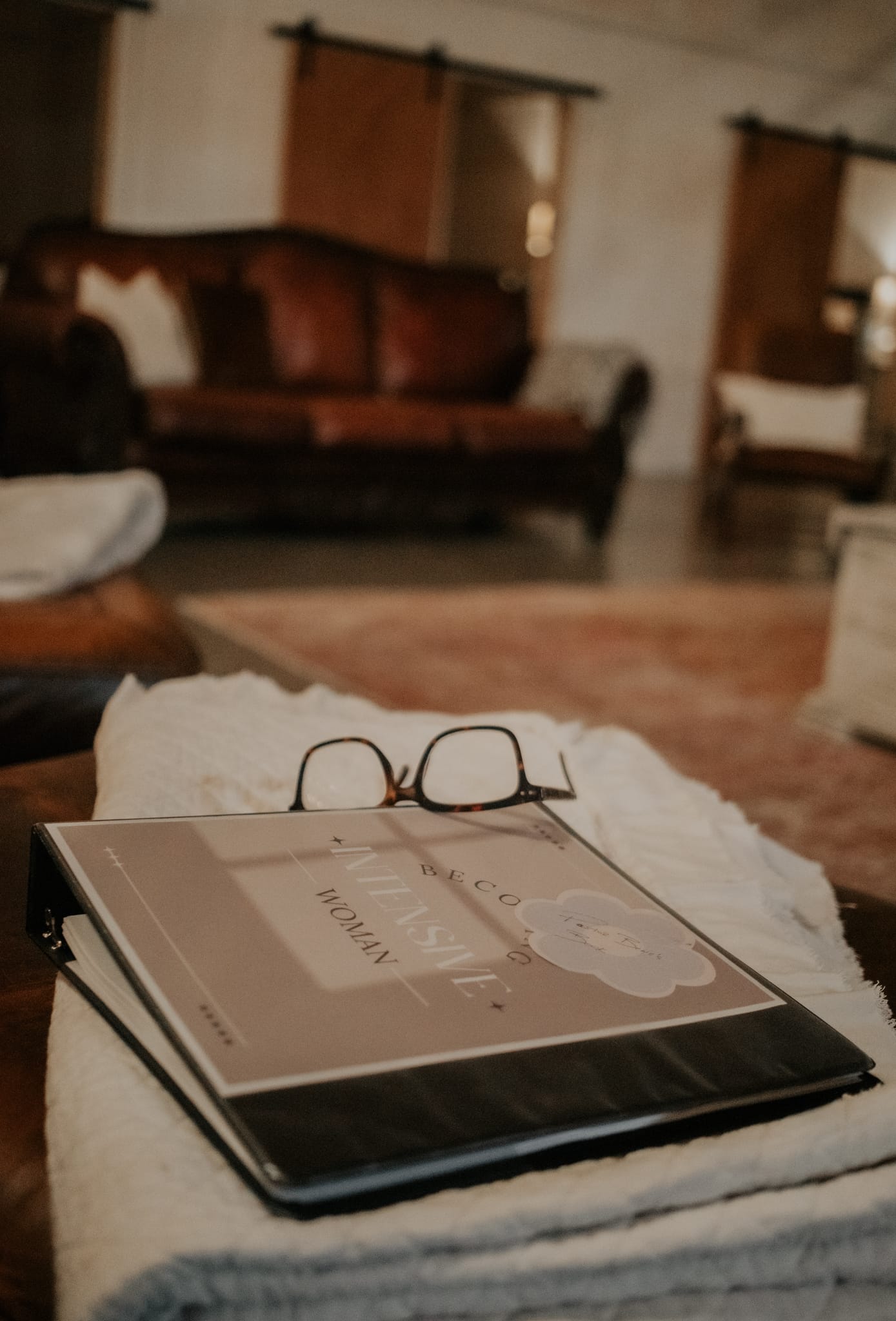 Woman journaling as part of the her. book companion